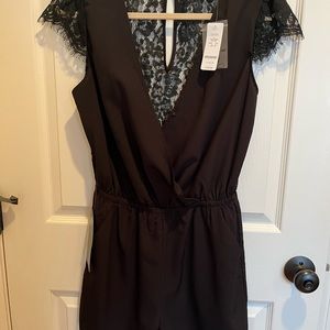 Bebe black romper with pockets